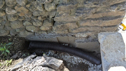 New drain next to stair wall